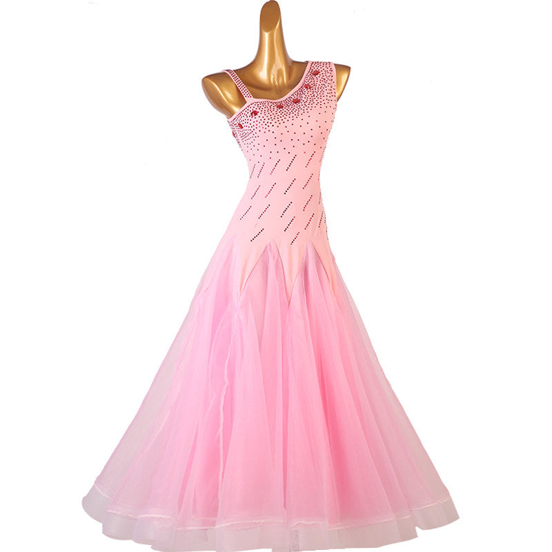 Pink ballroom competition dress front view with the tulle skirt spread
