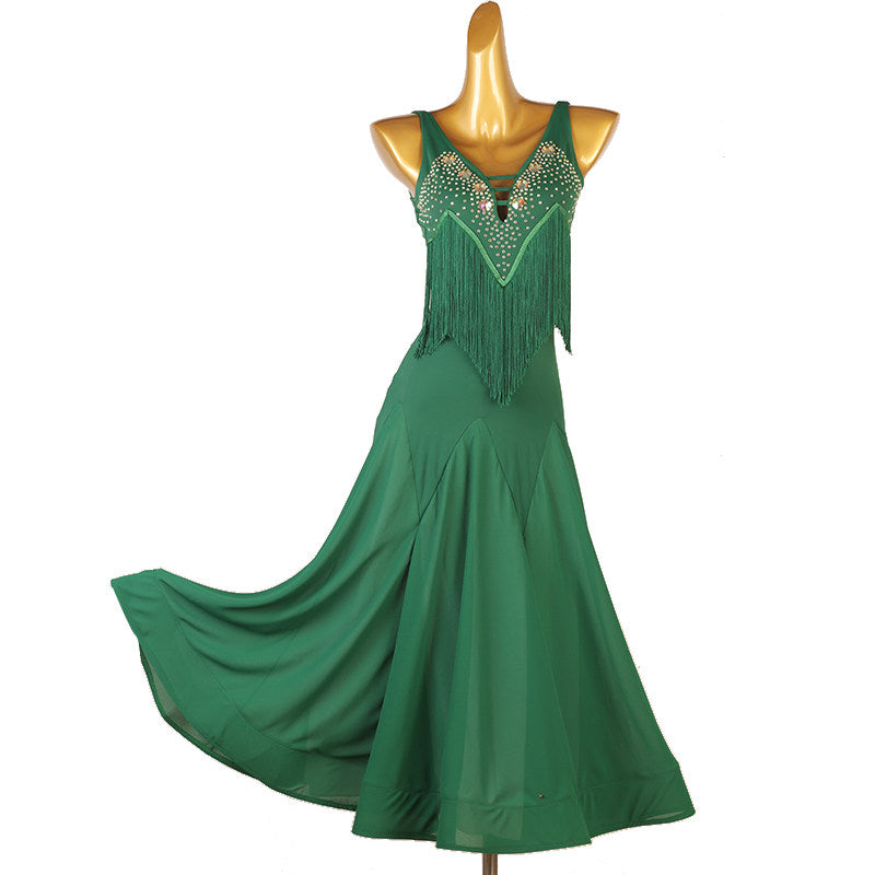 Green beaded fringe ballroom competition dress with the skirt swept out