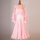 Pink ballroom dress showing the sheer mesh yoke above the cape ruffle