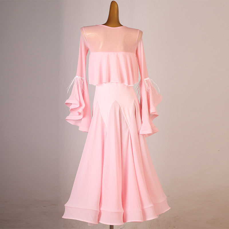 Pink ballroom dress showing the sheer mesh yoke above the cape ruffle