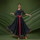 Black ballroom practice skirt with contrast satin hem binding seen from the front