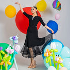 Black dot mesh ballroom dance skirt in motion on the closing step