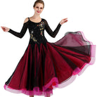 Black and red ballroom gown shown on a dancer with the skirt swept out
