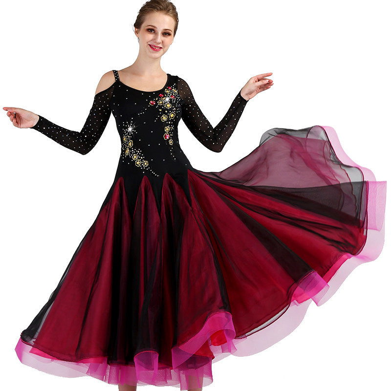 Black and red ballroom gown shown on a dancer with the skirt swept out