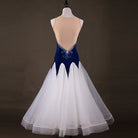 Navy ballroom gown back view showing the open back and tulle skirt