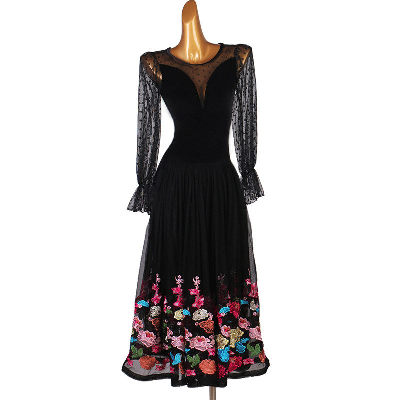 Front view of the black ballroom dress showing the deep V dotted mesh yoke