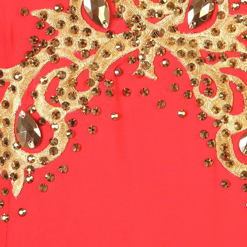 Close up of the gold sequins and rhinestones on the red bodice
