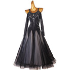 Black ballroom competition dress with the layered tulle skirt swept to the side