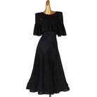Black practice dress front view with the cape ruffle over the arms