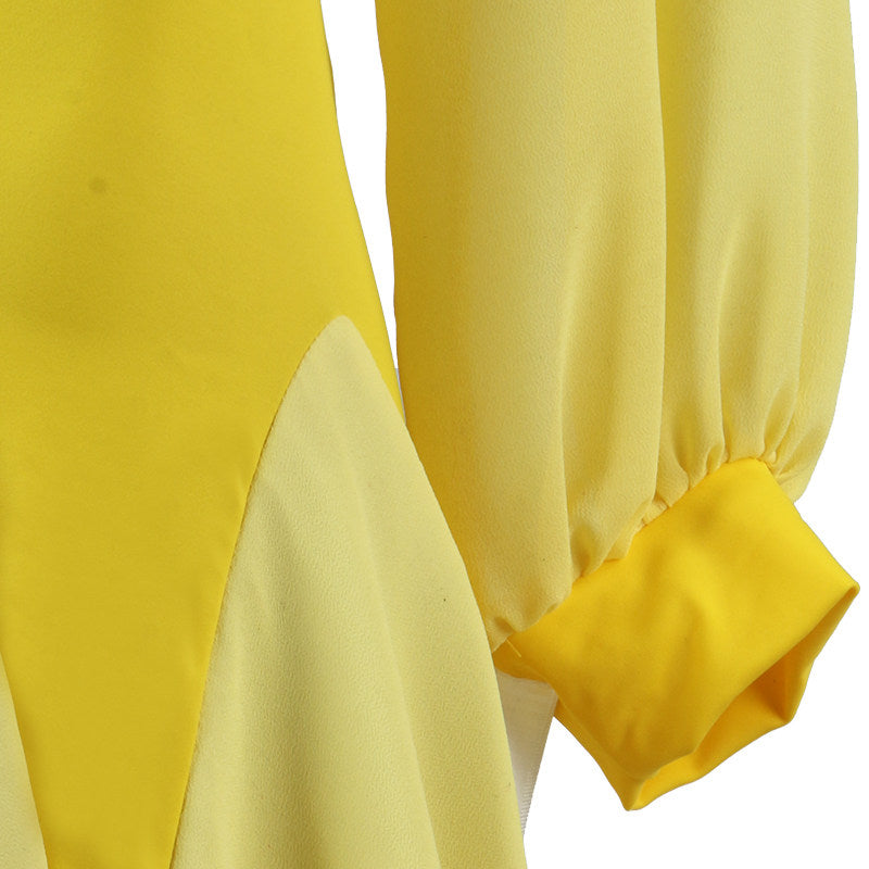 Close up of the pointed hip panel and lantern sleeve cuff on the yellow dress