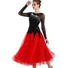 Black and red ballroom gown with arm raised showing mesh sleeve