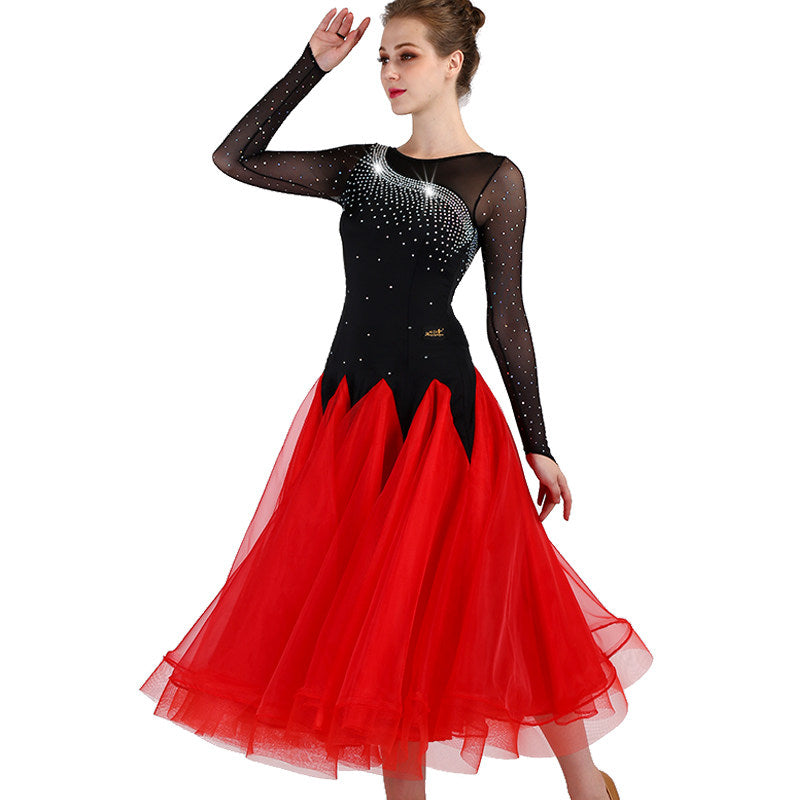 Black and red ballroom gown with arm raised showing mesh sleeve