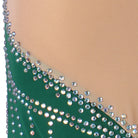 Detail of the rhinestone lines fanning across the green ballroom dress waist