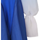 Detail of the royal blue bodice fabric beside the white chiffon cuff