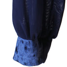 Detail of the navy chiffon skirt panels and velvet hem