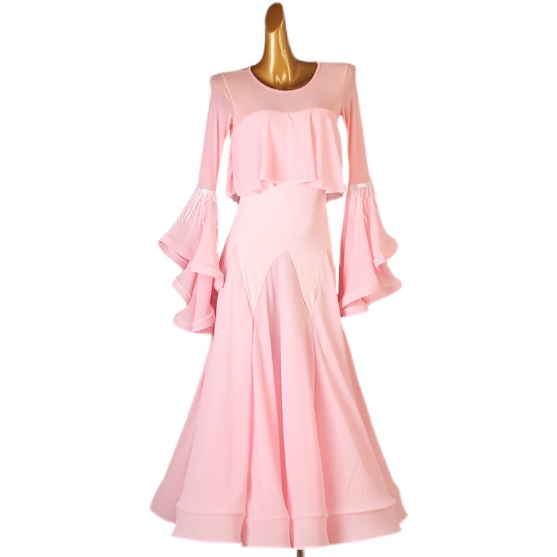 Pink ballroom practice dress photographed against a plain background