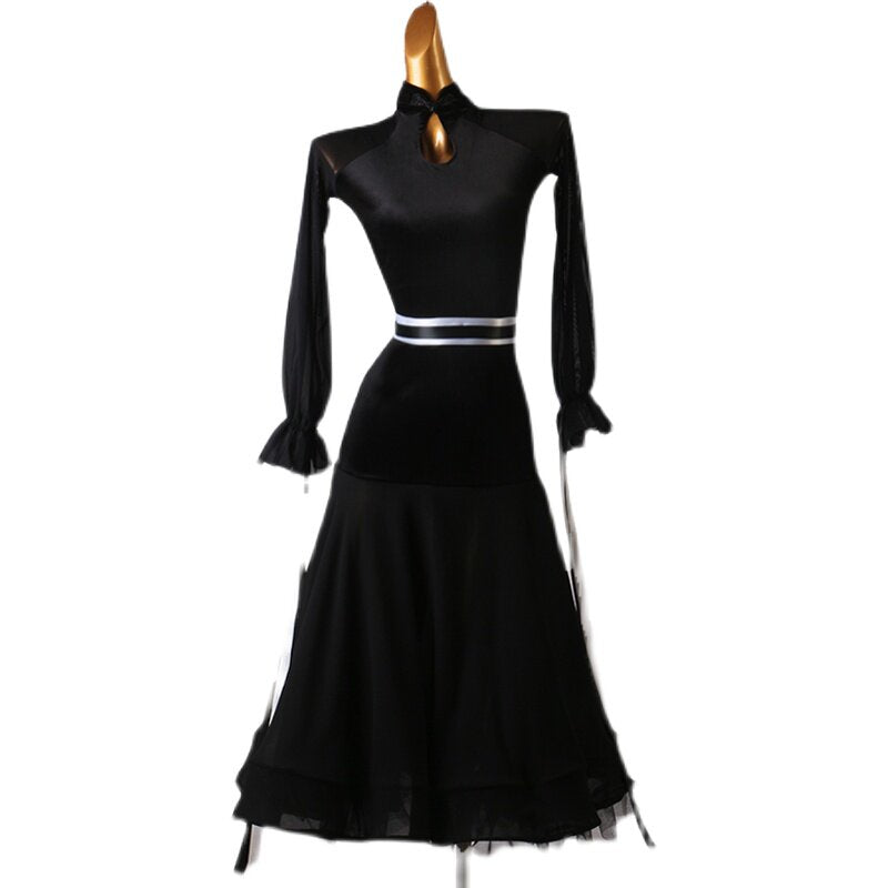 Black ballroom dance dress front view with mock neck and mesh peplum skirt