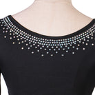 Close up of aurora rhinestones on the asymmetric neckline