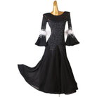 Black feather cuff ballroom dress with the godet skirt swept out behind