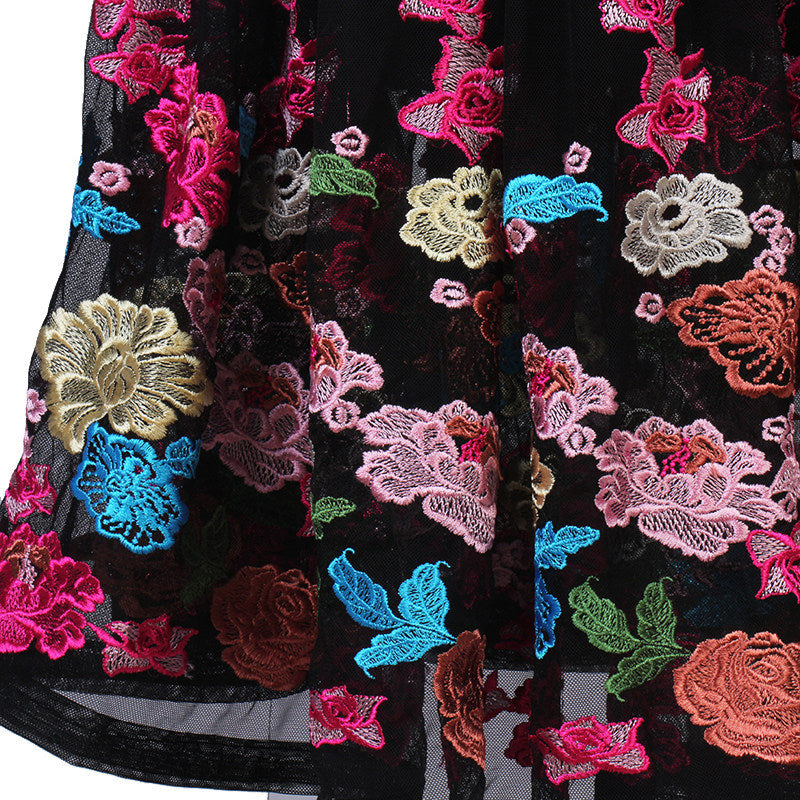 Close up of the multicolour floral embroidery on the skirt border