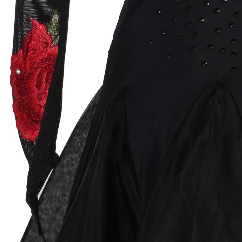 Close up of the red rose applique and rhinestones on black mesh