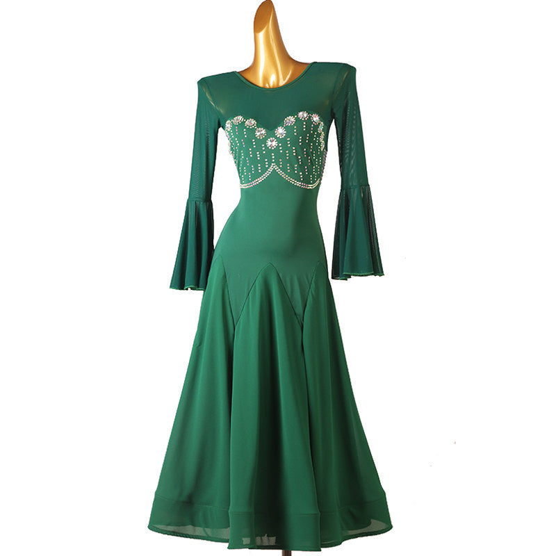 Green ballroom dress standing front view, beaded bust panel detail