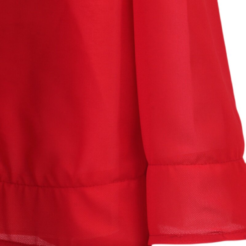 Close up of the red chiffon hem layers on the ombre ballroom dress