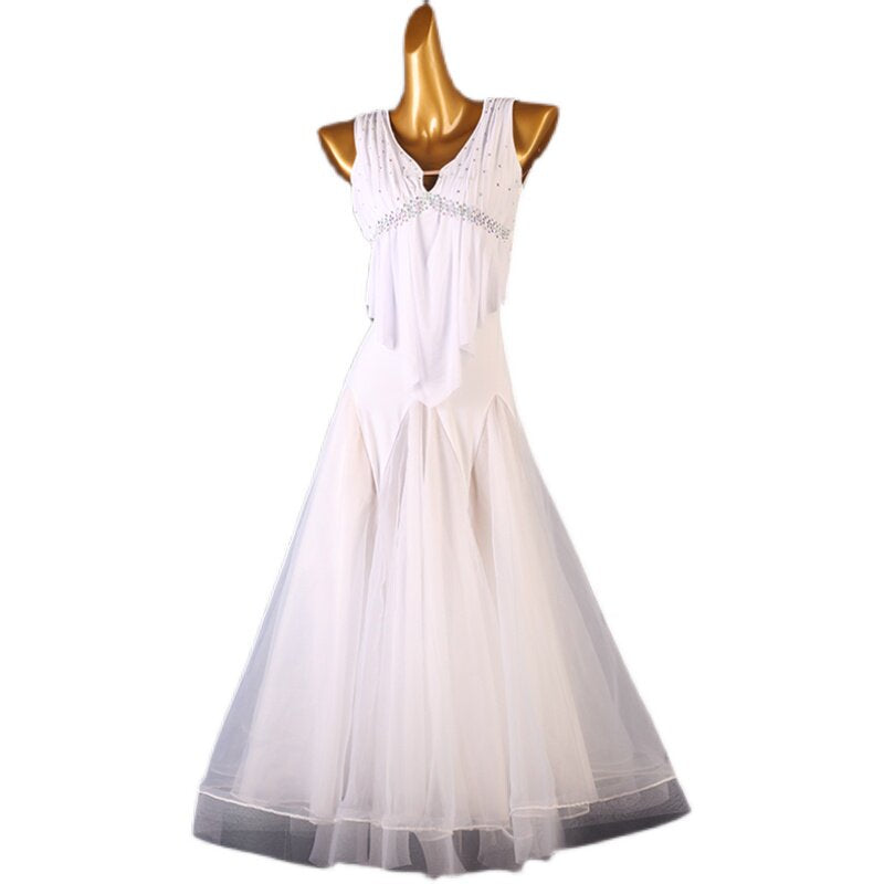 White beaded empire waist ballroom dress photographed on a light background