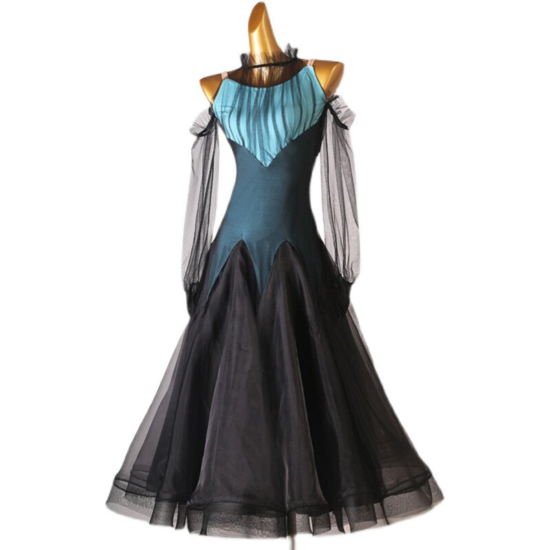 Teal ballroom dance dress with the black organza skirt swept to the side
