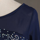 Silver bead and rhinestone detail on the navy velvet shoulder