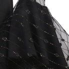 Close up of the metallic dot lace sleeve fabric