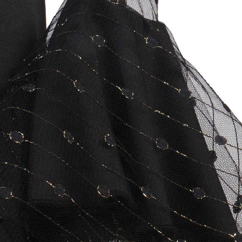 Close up of the metallic dot lace sleeve fabric