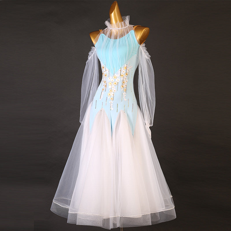 Light blue and ivory ballroom dress photographed against a dark background