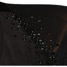 Detail of the scattered rhinestones along the applique on the velvet bodice