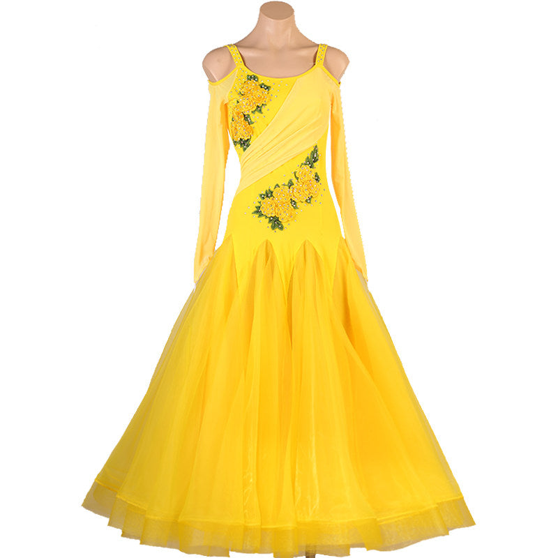Yellow organza ballroom competition dress photographed on a white background