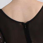 Rhinestone and mesh yoke detail at the neckline of the ballroom gown