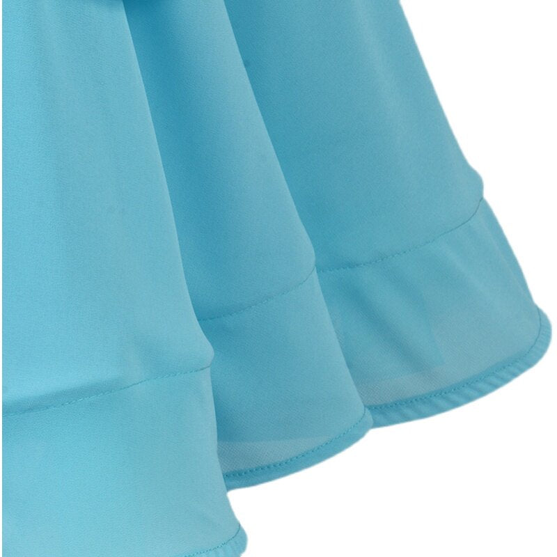 Detail of the tiered chiffon hem on the light blue ballroom dance dress