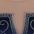Silver bead scroll embroidery detail on the navy velvet bodice