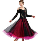 Black and red ballroom gown worn by a dancer, front view