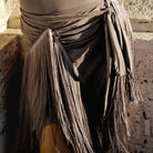 Grey side-tie fringe dance wrap skirt for Latin and salsa practice, close-up front view
