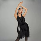 Black belted fringe Latin dance skirt shown with a halter top