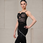 Black rhinestone fringe Latin skirt worn over leggings, front view