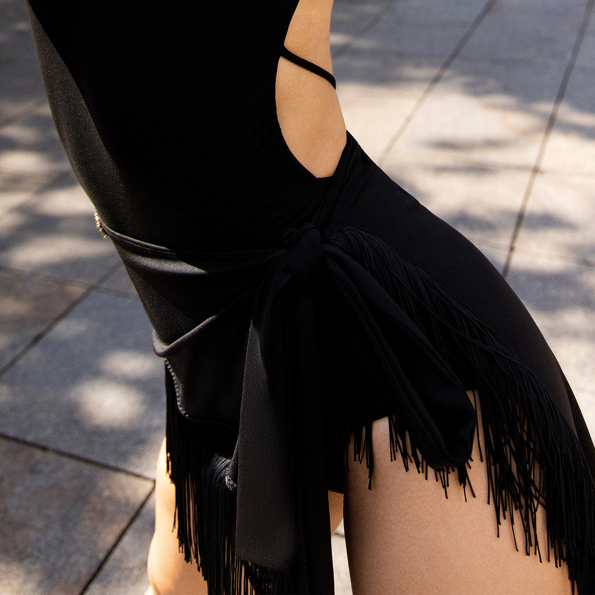 Black fringe hip scarf with side sash, side view