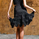 Black tiered fringe skirt held out to show the layers