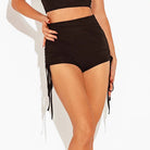 Black ruched Latin dance shorts with side drawstring, close view