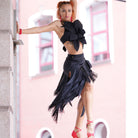Black fringe Latina skirt worn with a ruffle crop top