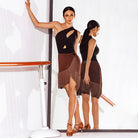 Black cut out Latin leotard worn with a fringe skirt