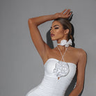White rose halter dance bodysuit, arm raised