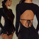 Black long sleeve dance bodysuit, open back with waist tie