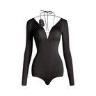 Black deep V long sleeve Latin dance bodysuit, flat lay